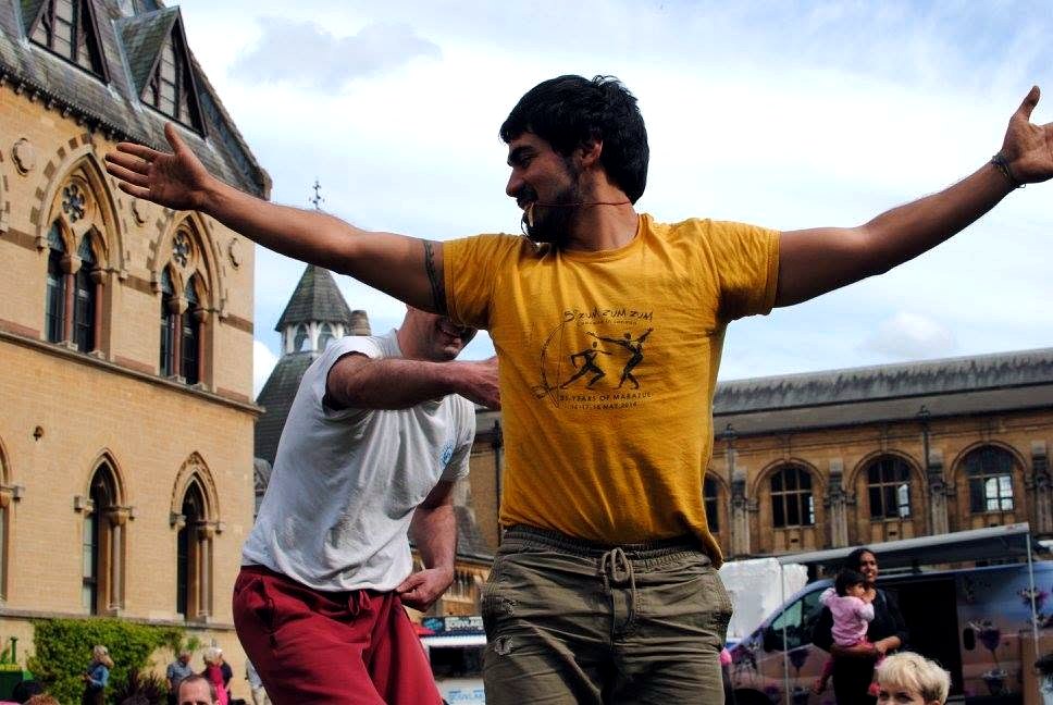 Professor Lobinho playing capoeira outside in Oxford