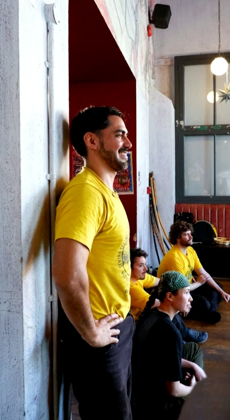 Professor Lobinho watching a Capoeira Angola roda